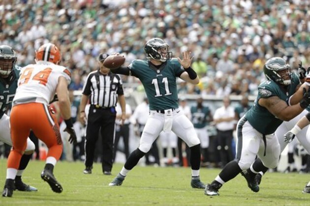 Philadelphia Eagles' Carson Wentz passes for his first career touchdown during the first half of an NFL football game against the Cleveland Browns, Sunday, Sept. 11, 2016, in Philadelphia. (AP Photo/Matt Rourke)