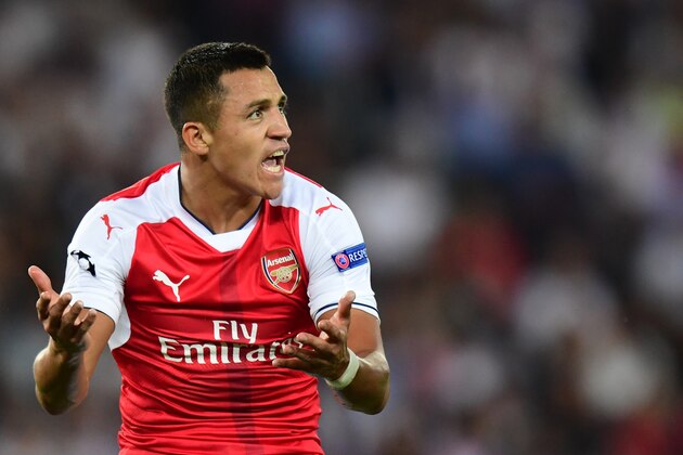 Arsenal's Chilean forward Alexis Sanchez reacts during the UEFA Champions League Group A football match between Paris-Saint-Germain vs Arsenal FC, on September 13, 2016 at the Parc des Princes stadium in Paris.  AFP PHOTO / FRANCK FIFE / AFP / FRANCK FIFE        (Photo credit should read FRANCK FIFE/AFP/Getty Images)