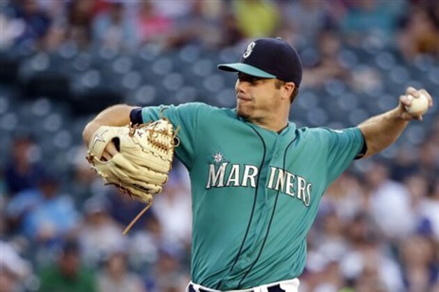 Seattle Mariners starting pitcher Wade LeBlanc throws against the Milwaukee Brewers in the first inning of a baseball game Friday, Aug. 19, 2016, in Seattle. (AP Photo/Elaine Thompson)