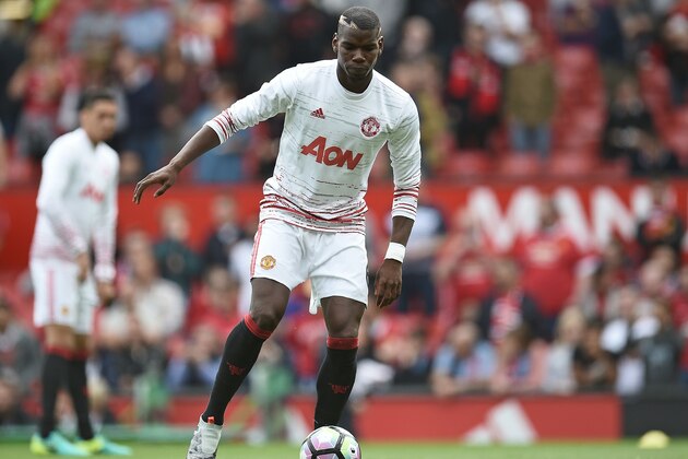 Manchester United's French midfielder Paul Pogba warms up ahead of the English Premier League football match between Manchester United and Manchester City at Old Trafford in Manchester, north west England, on September 10, 2016.
Jose Mourinho's United tackle Pep Guardiola's City in a feverishly anticipated local derby at Old Trafford. Both teams have won all three of their Premier League fixtures to date and while Mourinho believes it is too early to consider the game in any way decisive, he is well aware the points could be precious in the title race.
 / AFP / Oli SCARFF / RESTRICTED TO EDITORIAL USE. No use with unauthorized audio, video, data, fixture lists, club/league logos or 'live' services. Online in-match use limited to 75 images, no video emulation. No use in betting, games or single club/league/player publications.  /         (Photo credit should read OLI SCARFF/AFP/Getty Images)