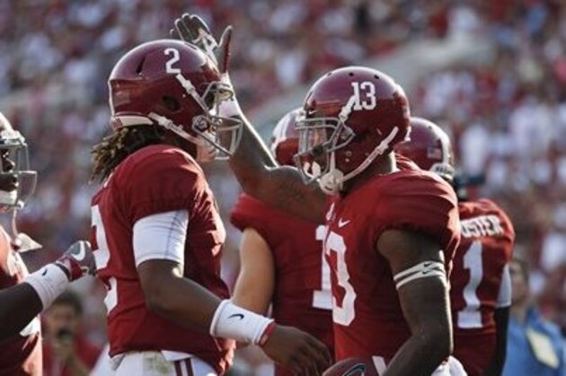 Alabama quarterback Jalen Hurts celebrates with Alabama wide receiver ArDarius Stewart during the second half of an NCAA college football game, Saturday, Sept. 10, 2016, in Tuscaloosa, Ala. (AP Photo/Brynn Anderson)
