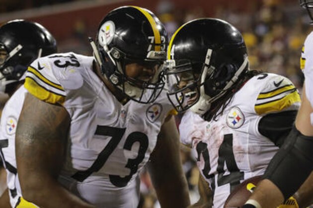 Pittsburgh Steelers running back DeAngelo Williams (34) celebrates his touchdown with guard Ramon Foster (73) during the second half of an NFL football game against the Washington Redskins in Landover, Md., Monday, Sept. 12, 2016. The Steelers defeated the Redskins 38-16. (AP Photo/Patrick Semansky)