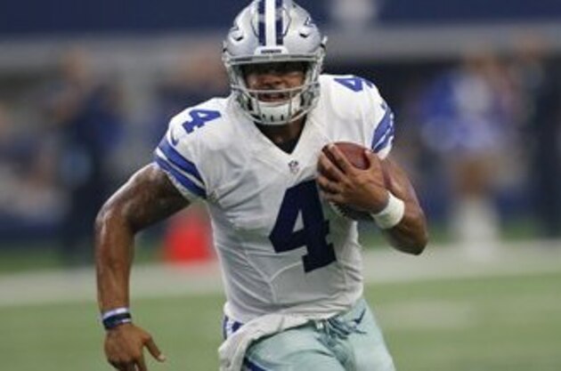 Dallas Cowboys quarterback Dak Prescott (4) runs the ball against the New York Giants in an NFL football game, Sunday Sept. 11,  2016, in Arlington, Texas. (AP Photo/Roger Steinman)