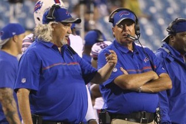 Buffalo Bills assistant head coach Rob Ryan, left, and his brother, head coach Rex Ryan, right, watches from the sideline during the second half of a preseason NFL football game against the Indianapolis Colts Saturday, Aug. 13, 2016, in Orchard Park, N.Y. (AP Photo/Bill Wippert)