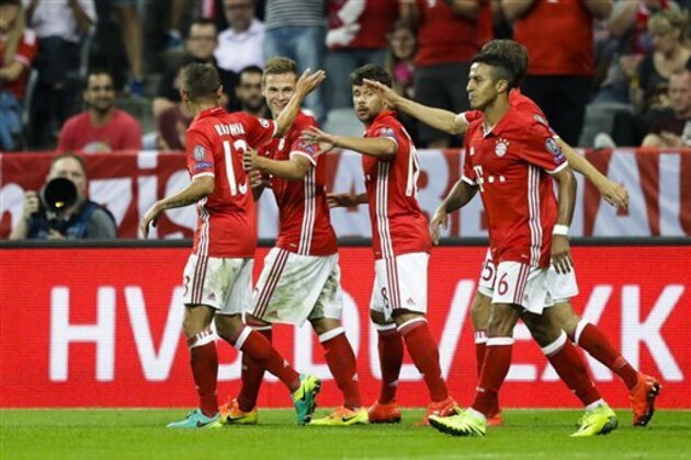 Bayern's Joshua Kimmich, 2. from left, celebrates with team mates after scoring their side's fourth goal during the Champions League Group D soccer match between FC Bayern Munich and FK Rostov in Munich, Germany, Tuesday, Sept. 13, 2016. (AP Photo/Matthias Schrader)