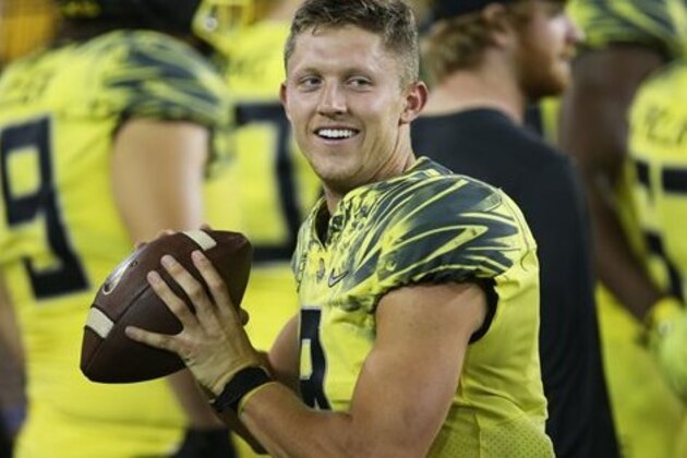 Oregon quarterback Dakota Prukop warms up on the sidelines during an NCAA  college football game against Virginia Saturday, Sept. 10, 2016 in Eugene, Ore. (AP Photo/Chris Pietsch)