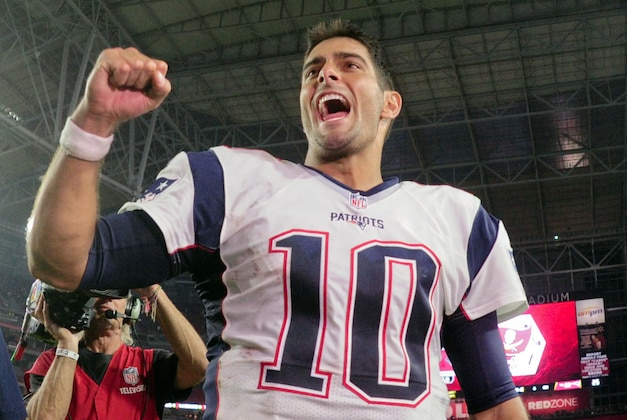 Sep 11, 2016; Glendale, AZ, USA;  New England Patriots quarterback Jimmy Garoppolo (10) celebrates after beating the Arizona Cardinals 23-21 at University of Phoenix Stadium. Mandatory Credit: Matt Kartozian-USA TODAY Sports