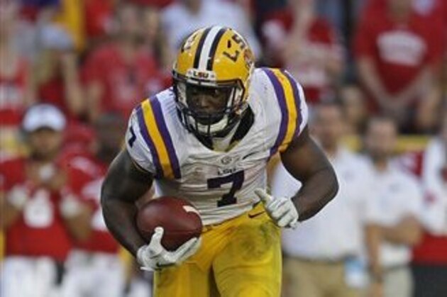 LSU's Leonard Fournette (7) runs during an NCAA college football game against Wisconsin Saturday, Sept. 3, 2016 in Green Bay, Wis. (AP Photo/Aaron Gash)