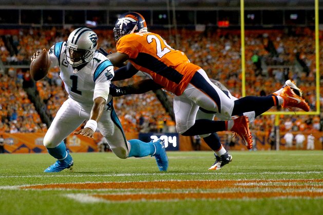 DENVER, CO - SEPTEMBER 08:  Quarterback Cam Newton #1 of the Carolina Panthers dives into the endzone to score on a two-yard run in the second quarter against free safety Darian Stewart #26 of the Denver Broncos at Sports Authority Field at Mile High on September 8, 2016 in Denver, Colorado.  (Photo by Justin Edmonds/Getty Images)