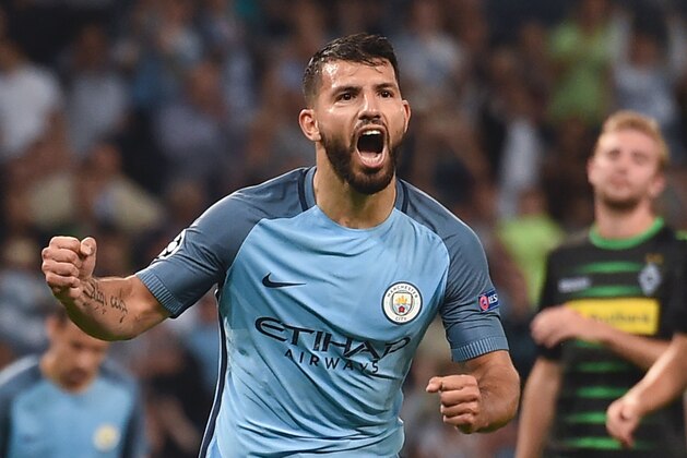 Manchester City's Argentinian striker Sergio Aguero celebrates scoring their second goal from a penalty during the UEFA Champions League group C football match between Manchester City and Borussia Monchengladbach at the Etihad stadium in Manchester, northwest England, on September 14, 2016. / AFP / PAUL ELLIS        (Photo credit should read PAUL ELLIS/AFP/Getty Images)