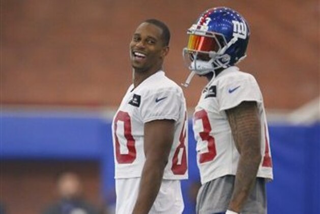 New York Giants wide receivers Victor Cruz (80) and Odell Beckham Jr. (13) stand together during a drill in practice at the team's NFL football camp, Sunday, July 31, 2016 in East Rutherford, N.J. (AP Photo/Rich Schultz)