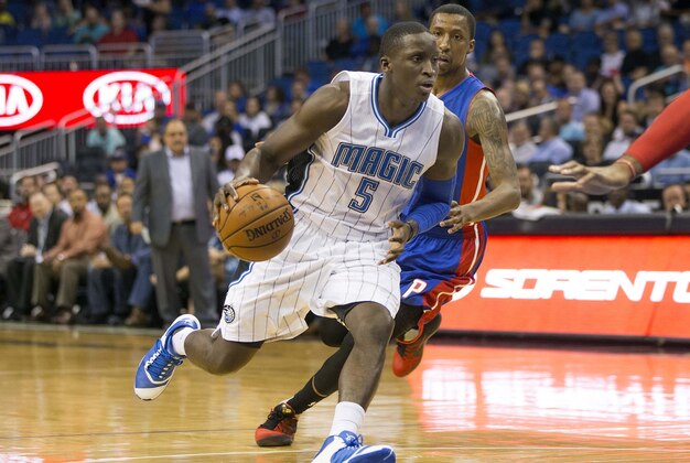 Apr 6, 2016; Orlando, FL, USA; Orlando Magic guard Victor Oladipo (5) drives to the net in front of Detroit Pistons guard Kentavious Caldwell-Pope (right) during the first quarter of a basketball game at Amway Center. Mandatory Credit: Reinhold Matay-USA TODAY Sports