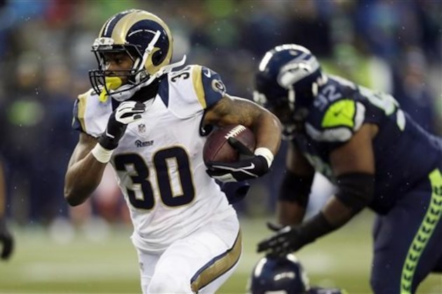 FILE - In this Sunday Dec. 27, 2015, file photo, St. Louis Rams' Todd Gurley runs against the Seattle Seahawks in the second half of an NFL football game in Seattle. Rams phenom Todd Gurley seems to have an inside track for the top pick in 2016, but he will have some stiff competition from wide receivers. (AP Photo/Stephen Brashear, File)