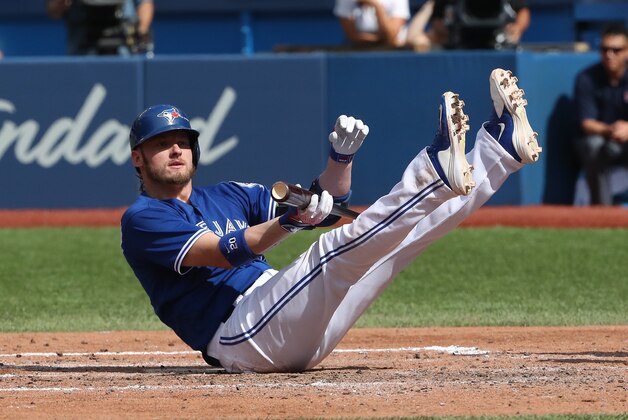 TORONTO, CANADA - SEPTEMBER 10: Josh Donaldson #20 of the Toronto Blue Jays falls after being knocked down by a high pitch in the fifth inning during MLB game action against the Boston Red Sox on September 10, 2016 at Rogers Centre in Toronto, Ontario, Canada. (Photo by Tom Szczerbowski/Getty Images)