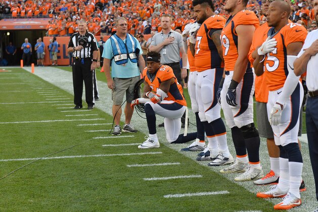 Sep 8, 2016; Denver, CO, USA; Denver Broncos inside linebacker Brandon Marshall (54) kneels during the national anthem before the game against the Carolina Panthers at Sports Authority Field at Mile High. Mandatory Credit: Ron Chenoy-USA TODAY Sports