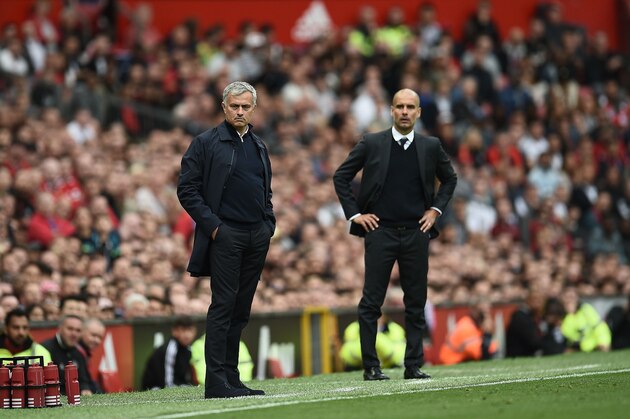 Manchester United's Portuguese manager Jose Mourinho (L) and Manchester City's Spanish manager Pep Guardiola (R) watch from the touchline during the English Premier League football match between Manchester United and Manchester City at Old Trafford in Manchester, north west England, on September 10, 2016. / AFP / Oli SCARFF / RESTRICTED TO EDITORIAL USE. No use with unauthorized audio, video, data, fixture lists, club/league logos or 'live' services. Online in-match use limited to 75 images, no video emulation. No use in betting, games or single club/league/player publications.  /         (Photo credit should read OLI SCARFF/AFP/Getty Images)
