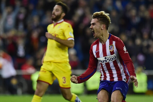 Atletico Madrid's French forward Antoine Griezmann celebrates after scoring during the Spanish league football match Club Atletico de Madrid vs Real Sporting de Gijon at the Vicente Calderon stadium in Madrid on November 8, 2015. AFP PHOTO/ PIERRE-PHILIPPE MARCOU        (Photo credit should read PIERRE-PHILIPPE MARCOU/AFP/Getty Images)