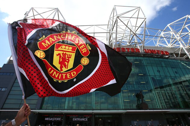 MANCHESTER, ENGLAND - MAY 15:  A supporter waves the flag prior to the Barclays Premier League match between Manchester United and AFC Bournemouth at Old Trafford on May 15, 2016 in Manchester, England.  (Photo by Alex Livesey/Getty Images)