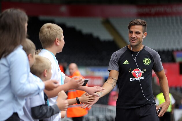 SWANSEA, WALES - SEPTEMBER 11: Cesc Fabregas of Chelsea is greeted by young supporters as he arrives prior to the Premier League match between Swansea City and Chelsea at The Liberty Stadium on September 11, 2016 in Swansea, Wales. (photo by Athena Pictures/Getty Images)