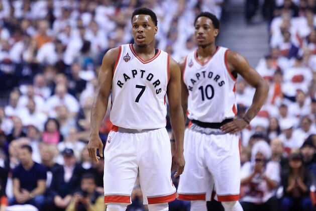 TORONTO, ON - MAY 15:  Kyle Lowry #7 and DeMar DeRozan #10 of the Toronto Raptors look on in the first half of Game Seven of the Eastern Conference Quarterfinals against the Miami Heat during the 2016 NBA Playoffs at the Air Canada Centre on May 15, 2016 in Toronto, Ontario, Canada.  NOTE TO USER: User expressly acknowledges and agrees that, by downloading and or using this photograph, User is consenting to the terms and conditions of the Getty Images License Agreement.  (Photo by Vaughn Ridley/Getty Images)
