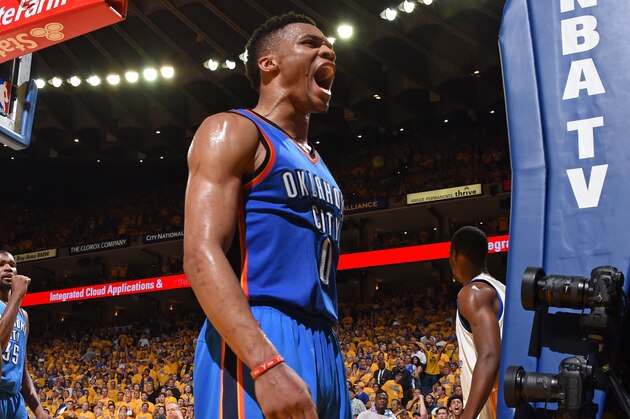 OAKLAND, CA - MAY 30:  Russell Westbrook #0 of the Oklahoma City Thunder yells to celebrate during Game Seven of the Western Conference Finals against the Golden State Warriors during the 2016 NBA Playoffs on May 30, 2016 at ORACLE Arena in Oakland, California. NOTE TO USER: User expressly acknowledges and agrees that, by downloading and or using this Photograph, user is consenting to the terms and conditions of the Getty Images License Agreement. Mandatory Copyright Notice: Copyright 2016 NBAE (Photo by Andrew Bernstein/NBAE via Getty Images)