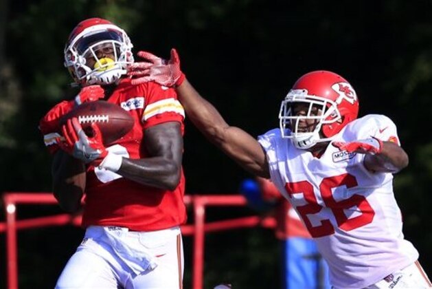 Kansas City Chiefs wide receiver Seantavius Jones (6) catches the ball over cornerback KeiVarae Russell (26) during NFL football training camp in St. Joseph, Mo., Wednesday, Aug. 10, 2016. (AP Photo/Orlin Wagner)