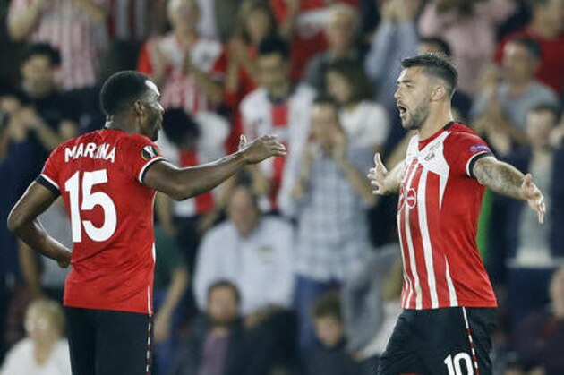 Southampton's Charlie Austin, right, and Cuco Martina celebrate after scoring during the Europa League group K soccer match between Southampton and Sparta Prague at St Mary's stadium in Southampton, England, Thursday, Sept. 15, 2016 . (AP Photo/Frank Augstein)