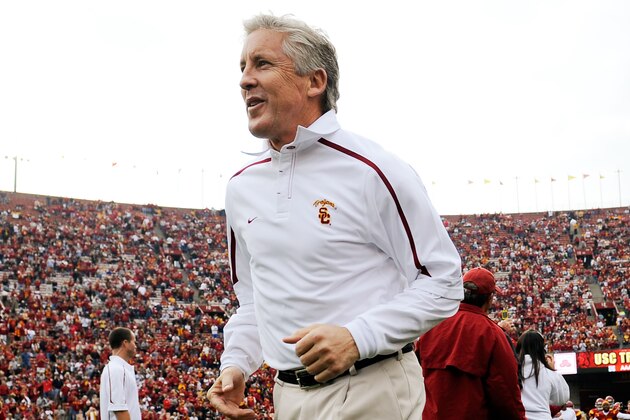 LOS ANGELES, CA - DECEMBER 05:  Coach Pete Carroll of the USC Trojans leads his team to the field prior to the start of the NCAA college football game against Arizona Wildcats at the Los Angeles Coliseum on December 5, 2009 in Los Angeles, California.  (Photo by Kevork Djansezian/Getty Images)