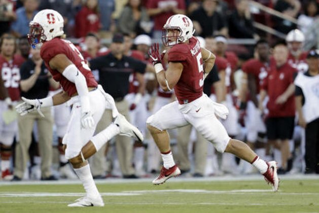 Stanford running back Christian McCaffrey, right, runs for a 35-yard touchdown against Kansas State during the first half of an NCAA college football game Friday, Sept. 2, 2016, in Stanford, Calif. (AP Photo/Marcio Jose Sanchez)