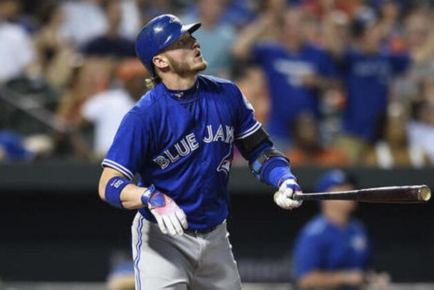 Toronto Blue Jays' Josh Donaldson watches his solo home run against the Baltimore Orioles in the fourth inning of a baseball game, Monday, Aug. 29, 2016, in Baltimore. (AP Photo/Gail Burton)