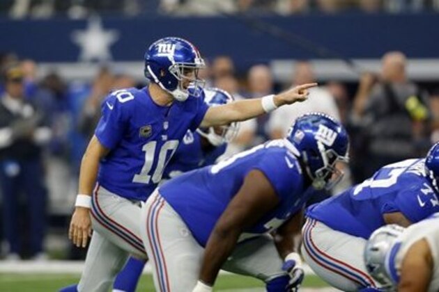 New York Giants quarterback Eli Manning (10) signals at the line of scrimmage during an NFL football game against the Dallas Cowboys on Sunday Sept. 11,  2016, in Arlington, Texas. (AP Photo/Roger Steinman)