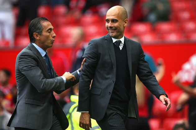 MANCHESTER, ENGLAND - SEPTEMBER 10: Josep Guardiola, Manager of Manchester City walks off the pitch with a member of staff  during the Premier League match between Manchester United and Manchester City at Old Trafford on September 10, 2016 in Manchester, England.  (Photo by Alex Livesey/Getty Images)