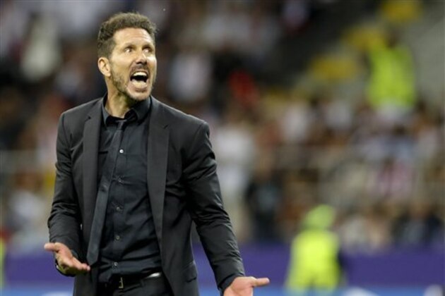 Atletico's coach Diego Simeone reacts during the Champions League final soccer match between Real Madrid and Atletico Madrid at the San Siro stadium in Milan, Italy, Saturday, May 28, 2016.  (AP Photo/Luca Bruno)