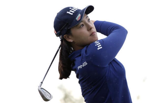In Gee Chun of South Korea follows the flight of her ball after playing on the 16th hole, during the second round of the Evian Championship women's golf tournament in Evian, eastern France, Friday, Sept. 16, 2016. (AP Photo/Laurent Cipriani)