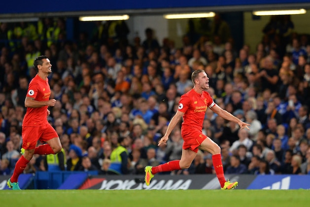 Liverpool's English midfielder Jordan Henderson (R) celebrates scoring his team's second goal during the English Premier League football match between Chelsea and Liverpool at Stamford Bridge in London on September 16, 2016. / AFP / GLYN KIRK / RESTRICTED TO EDITORIAL USE. No use with unauthorized audio, video, data, fixture lists, club/league logos or 'live' services. Online in-match use limited to 75 images, no video emulation. No use in betting, games or single club/league/player publications.  /         (Photo credit should read GLYN KIRK/AFP/Getty Images)
