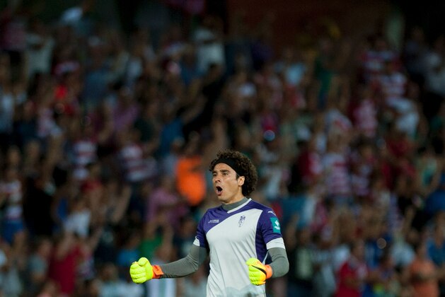 Granada's Mexican goalkeeper Guillermo Ochoa celebrates a goal during the Spanish league football match Granada FC vs Villarreal CF at Nuevo Los Carmenes stadium in Granada on August 20, 2016. / AFP / JORGE GUERRERO        (Photo credit should read JORGE GUERRERO/AFP/Getty Images)