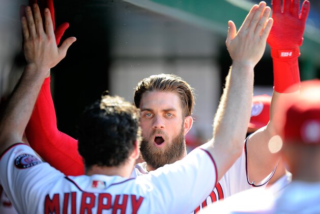 WASHINGTON, DC - AUGUST 28:  Bryce Harper #34 of the Washington Nationals celebrates with Daniel Murphy #20 after hitting a home run in the ninth inning against the Colorado Rockies at Nationals Park on August 28, 2016 in Washington, DC.  (Photo by G Fiume/Getty Images)