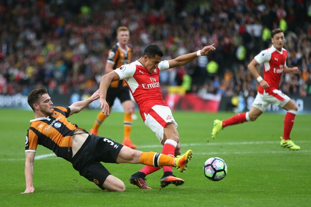 HULL, ENGLAND - SEPTEMBER 17:  Andrew Robertson of Hull City tackles Alexis Sanchez of Arsenal   during the Premier League match between Hull City and Arsenal at KCOM Stadium on September 17, 2016 in Hull, England.  (Photo by Alex Morton/Getty Images)