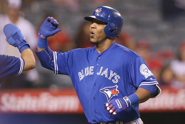 ANAHEIM, CALIFORNIA - SEPTEMBER 16:  Edwin Encarnacion #10 of the Toronto Blue Jays celebrates as he returns to the dugout after hitting a two run home run in the ninth inning against the Los Angeles Angels of Anaheim at Angel Stadium of Anaheim on September 16, 2016 in Anaheim, California.  (Photo by Stephen Dunn/Getty Images)