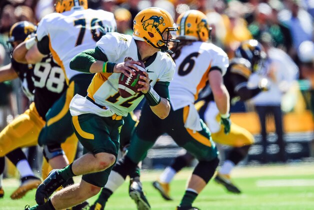 Sep 17, 2016; Iowa City, IA, USA; North Dakota State Bison quarterback Easton Stick (12) rolls out of the pocket during the second quarter against the Iowa Hawkeyes at Kinnick Stadium. Mandatory Credit: Jeffrey Becker-USA TODAY Sports