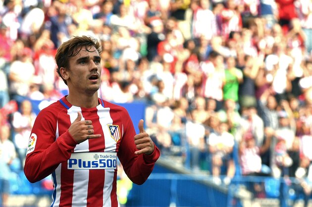 Atletico Madrid's French forward Antoine Griezmann celebrates after scoring during the Spanish league football match Club Atletico de Madrid vs Real Sporting de Gijon at the Vicente Calderon stadium in Madrid on September 17, 2016. / AFP / GERARD JULIEN        (Photo credit should read GERARD JULIEN/AFP/Getty Images)