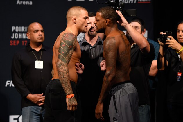 HIDALGO, TX - SEPTEMBER 16:  (L-R) Dustin Poirier of the United States and Michael Johnson of the United States face off during the UFC Fight Night weigh-in at the State Farm Arena on September 16, 2016 in Hidalgo, Texas. (Photo by Josh Hedges/Zuffa LLC/Zuffa LLC via Getty Images)