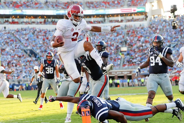 OXFORD, MS - SEPTEMBER 17:  Jalen Hurts #2 of the Alabama Crimson Tide leaps over Terry Caldwell #21 of the Mississippi Rebels at Vaught-Hemingway Stadium on September 17, 2016 in Oxford, Mississippi.  (Photo by Kevin C. Cox/Getty Images)