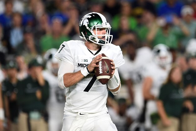 SOUTH BEND, IN - SEPTEMBER 17: Tyler O'Connor #7 of the Michigan State Spartans drops back to pass during the second half of a game against the Notre Dame Fighting Irish at Notre Dame Stadium on September 17, 2016 in South Bend, Indiana. Michigan State defeated Notre Dame 36-28. (Photo by Stacy Revere/Getty Images)