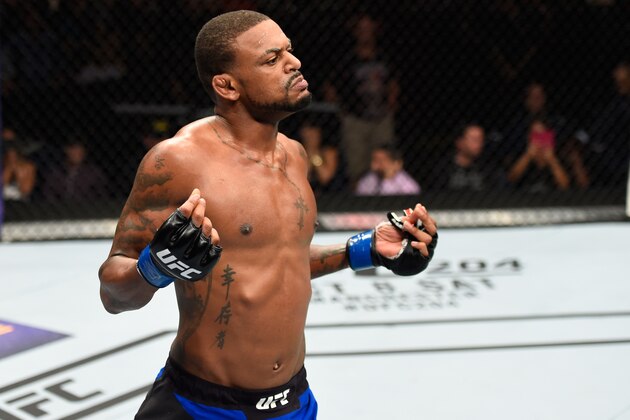 HIDALGO, TX - SEPTEMBER 17:   Michael Johnson celebrates his knockout victory over Dustin Poirier in their lightweight bout during the UFC Fight Night event at State Farm Arena on September 17, 2016 in Hidalgo, Texas. (Photo by Josh Hedges/Zuffa LLC/Zuffa LLC via Getty Images)