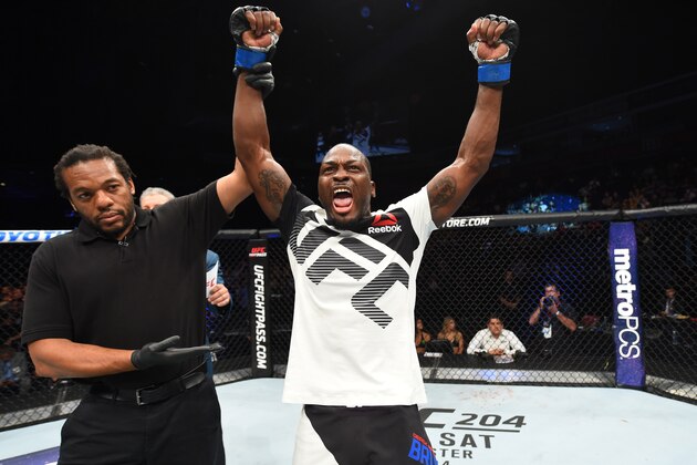 HIDALGO, TX - SEPTEMBER 17:   Derek Brunson celebrates his knockout victory over Uriah Hall of Jamaica in their middleweight bout during the UFC Fight Night event at State Farm Arena on September 17, 2016 in Hidalgo, Texas. (Photo by Josh Hedges/Zuffa LLC/Zuffa LLC via Getty Images)