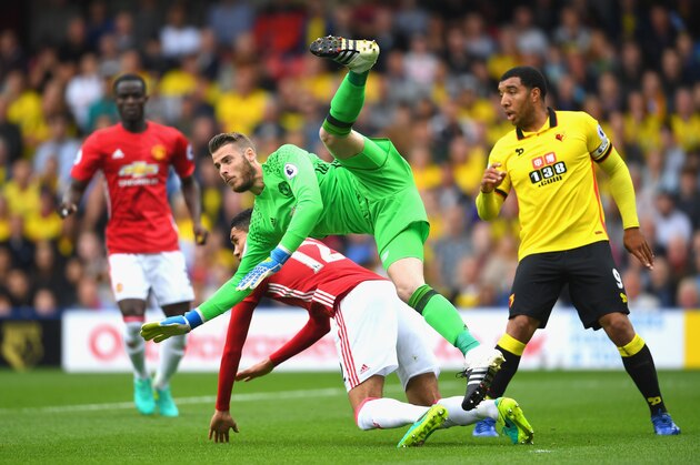 WATFORD, ENGLAND - SEPTEMBER 18:  David De Gea of Manchester United attempts to collect the ball from a cross but colides with Chris Smalling of Manchester United during the Premier League match between Watford and Manchester United at Vicarage Road on September 18, 2016 in Watford, England.  (Photo by Laurence Griffiths/Getty Images)