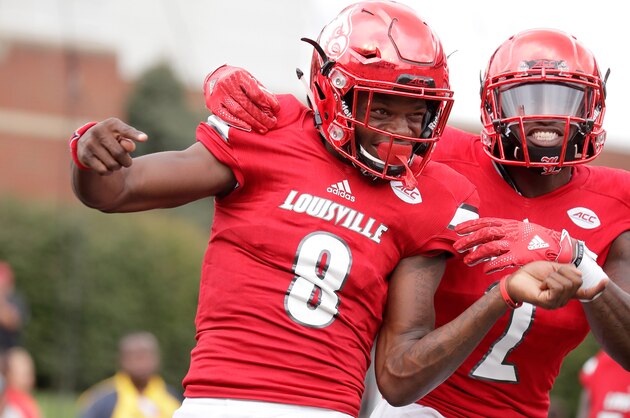 LOUISVILLE, KY - SEPTEMBER 17:  Lamar Jackson #8 of the Louisville Cardinals celebrates with Jamari Staples #2 after he ran for a touchdown against the Florida State Seminoles  at Papa John's Cardinal Stadium on September 17, 2016 in Louisville, Kentucky.  (Photo by Andy Lyons/Getty Images)