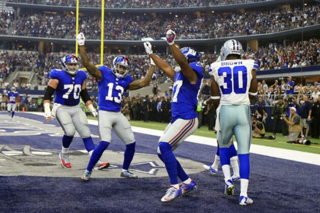 New York Giants center Weston Richburg (70) and Odell Beckham (13) celebrate with Sterling Shepard, second from right, after Shepard caught a pass for a touchdown in front of Dallas Cowboys cornerback Anthony Brown (30) in the first half of an NFL football game, Sunday Sept. 11, 2016, in Arlington, Texas. (AP Photo/Ron Jenkins)