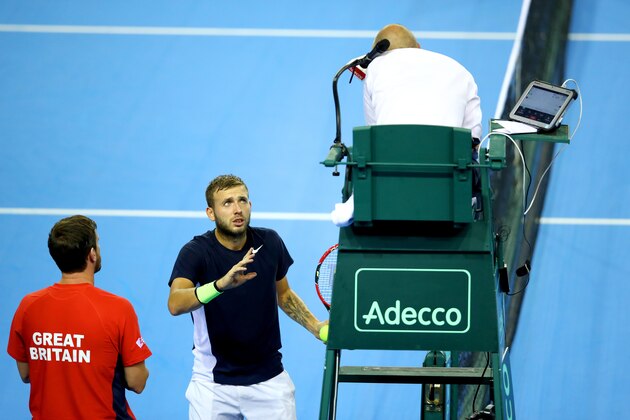 GLASGOW, SCOTLAND - SEPTEMBER 18:  Dan Evans of Great Britain and Great Britain team captain, Leon Smith speak with the chair umpire during his singles match against Leonardo Mayer of Argentina during day three of the Davis Cup semi final between Great Britain and Argentina at Emirates Arena on September 18, 2016 in Glasgow, Scotland.  (Photo by Clive Brunskill/Getty Images)